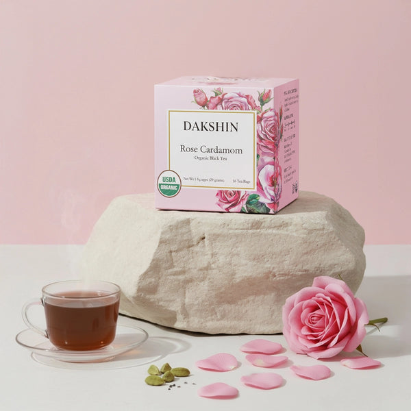 Calm Digestive Organic Rose & Cardamom Tea by Dakshin with rose petals and cardamom pods